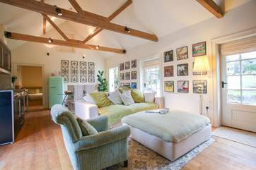 The comfortable large open plan living space features high ceilings.
