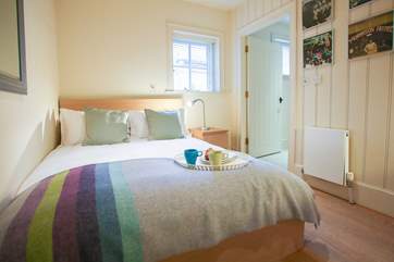 Comfortable double bedroom with an en suite bathroom.
