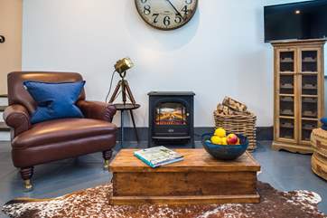 To make the room extra cosy, The Lambing Shed has an electric stove - all the romance of a wood-burning stove without the effort!