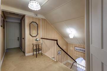 Elegant stairs leading to all the bedrooms.