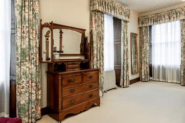 Feel grand in this spacious bedroom.