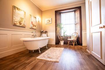 This gorgeous room has a bath, separate shower and double wash-basins.