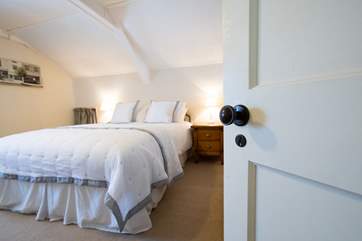 King-size bed on the second floor.