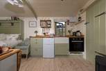The kitchen includes a combination oven, double hob, kettle, toaster and small fridge/freezer - all you could need to rustle up a scrumptious supper. 