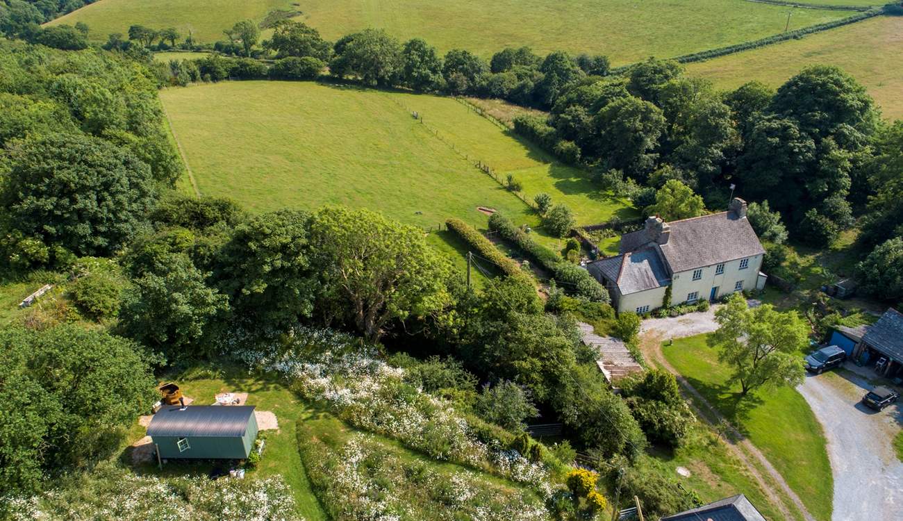 Surrounded by patchwork farmland and rolling countryside.
