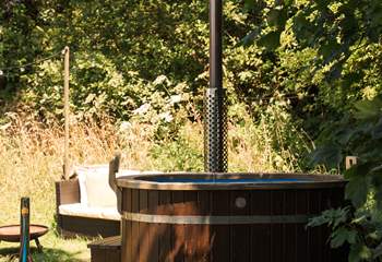 Sink into the wood-fired hot tub wrapped in countryside calm. 
