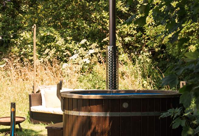 Sink into the wood-fired hot tub wrapped in countryside calm. 