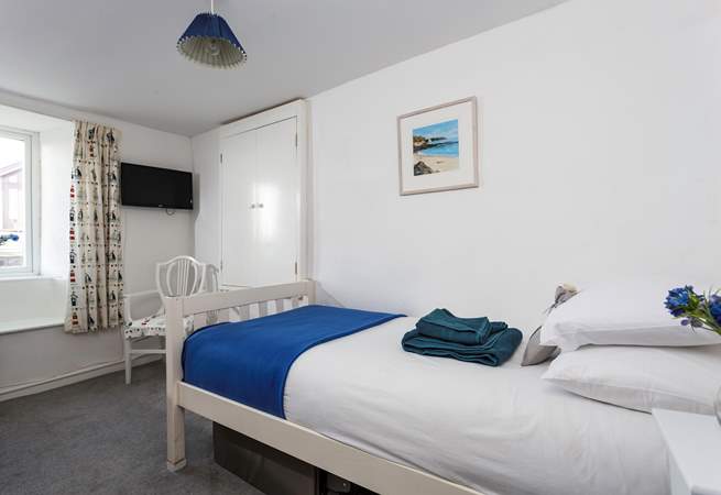 This is the very pretty single bedroom which has lovely views over Crantock and you can even see the church. 