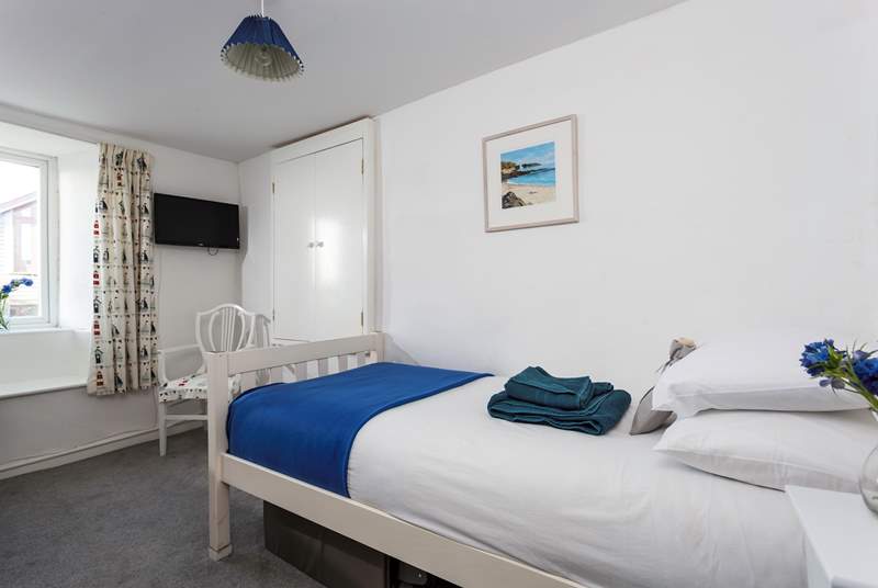 This is the very pretty single bedroom which has lovely views over Crantock and you can even see the church. 