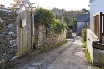 This view is taken from the lane, looking down towards Crantock. Langurra is behind the wooden gate on the left-hand side.