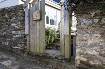Four granite steps lead up from the lane to the terrace at Langurra.