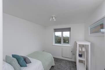 Bedroom three has a single bed with storage for your belongings.