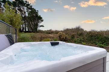 Watch the sunset from the bubbling hot tub.