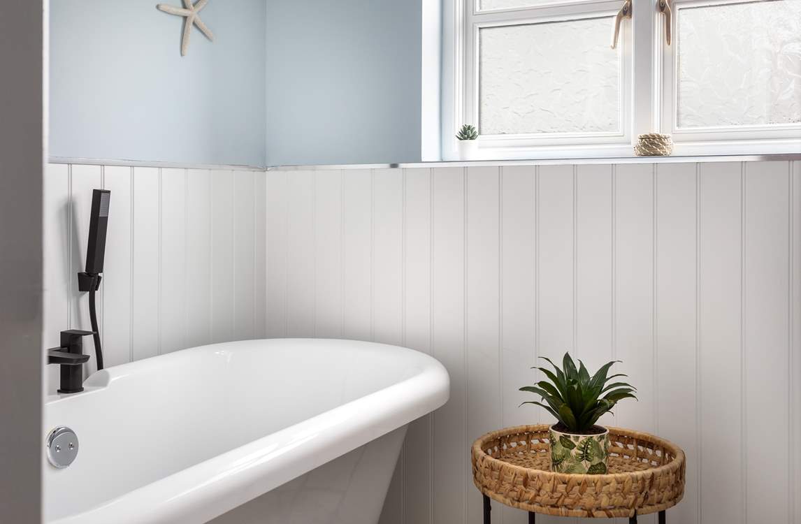 The beautiful family shower-room has a fabulous very indulgent roll-top bath to enjoy - bliss!