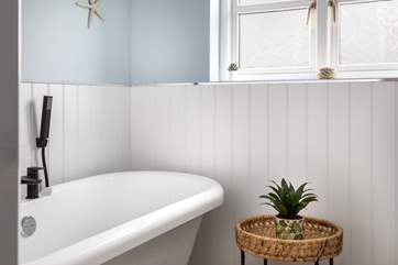 The beautiful family shower-room has a fabulous very indulgent roll-top bath to enjoy - bliss!