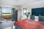 The master bedroom is an oasis of calm with a super-comfy bed.
