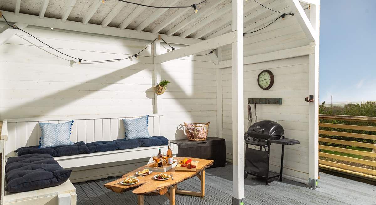 This is one of the areas of outdoor living. It is undercover so rain or shine you can always eat al fresco. There are 3 steps down from the deck to the garden.