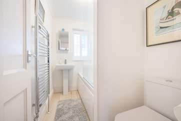 The first floor family bathroom with bath and fitted shower.