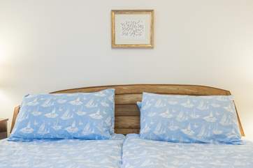 The headboard in the main bedroom is designed and made from a boat by the owners themselves.
