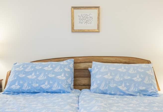 The headboard in the main bedroom is designed and made from a boat by the owners themselves.