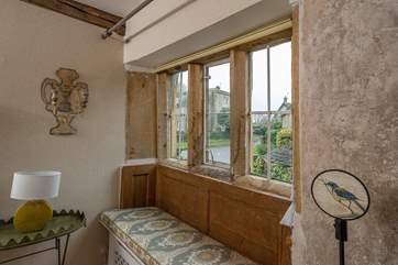 Take a moment to sit in the gorgeous window seat and admire the historic wall etchings.