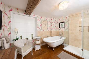 The luxurious main bathroom is the perfect place to unwind.