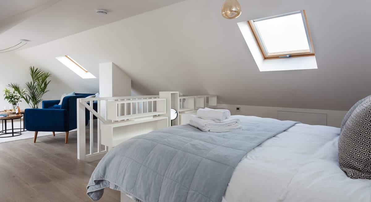 The second floor bedroom is wonderfully light and also enjoys views of the sea.