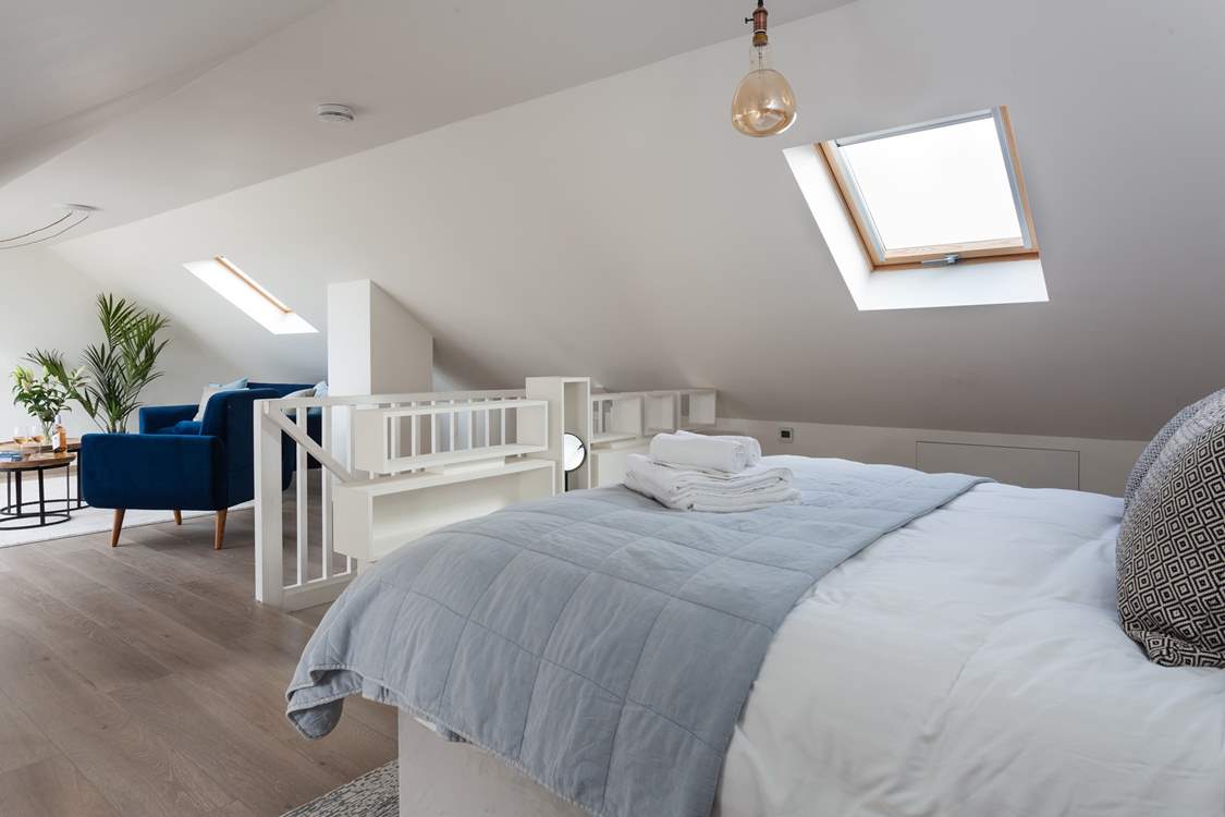 The second floor bedroom is wonderfully light and also enjoys views of the sea.