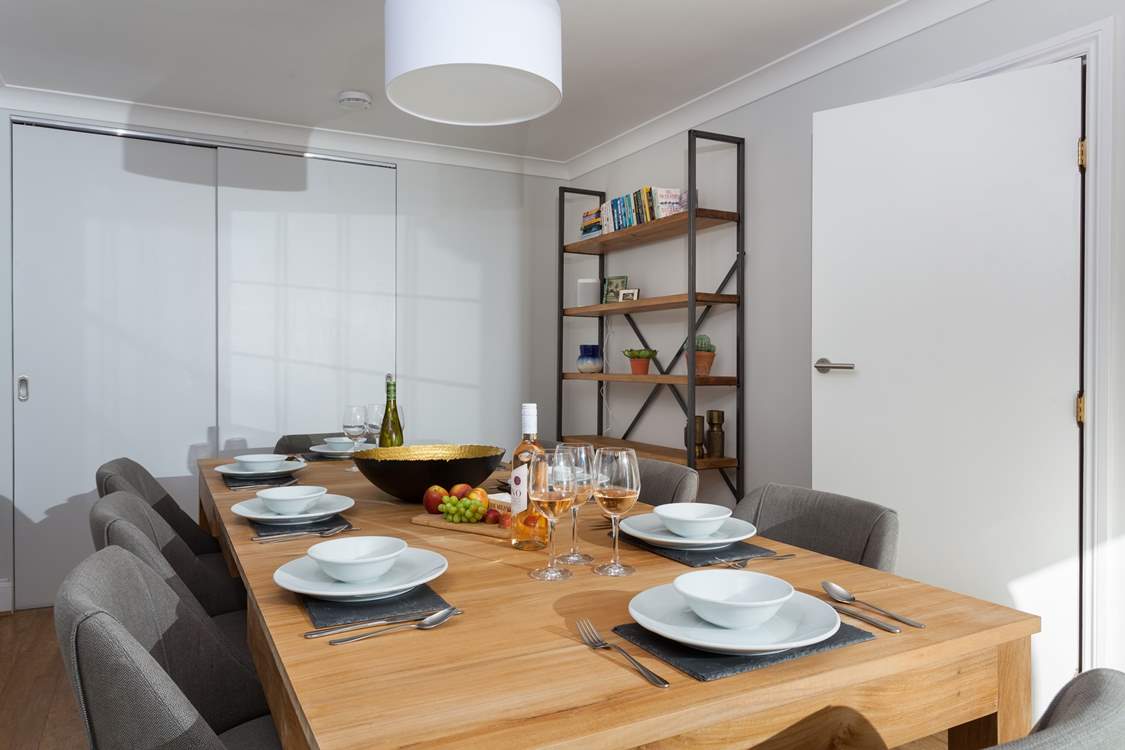 The more formal dining-room also has patio doors which open up onto a decked seating-area.