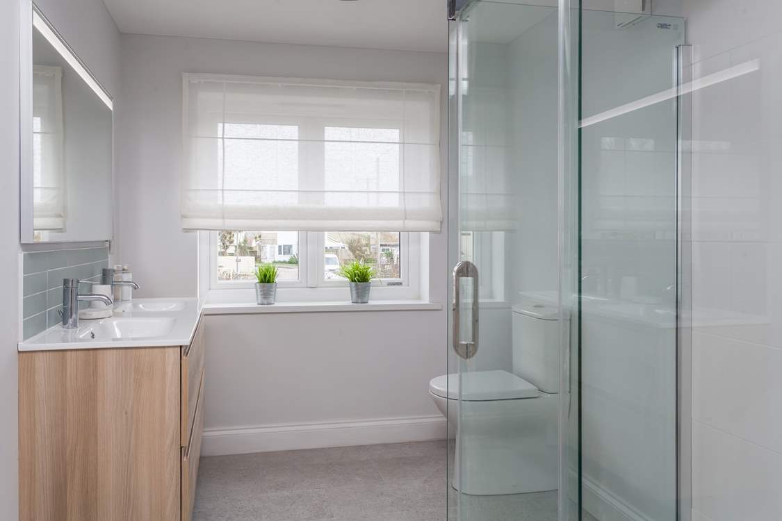 The gorgeous family shower-room with twin sinks located on the first floor.