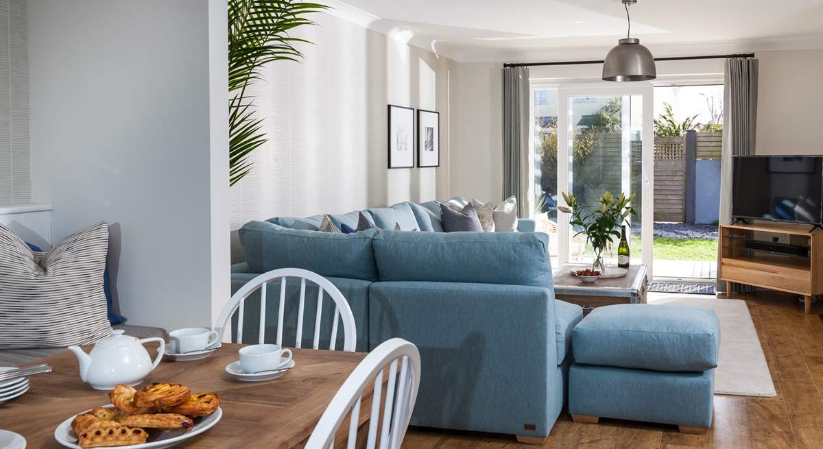 View from the dining-table into the sitting-area and out to the garden.