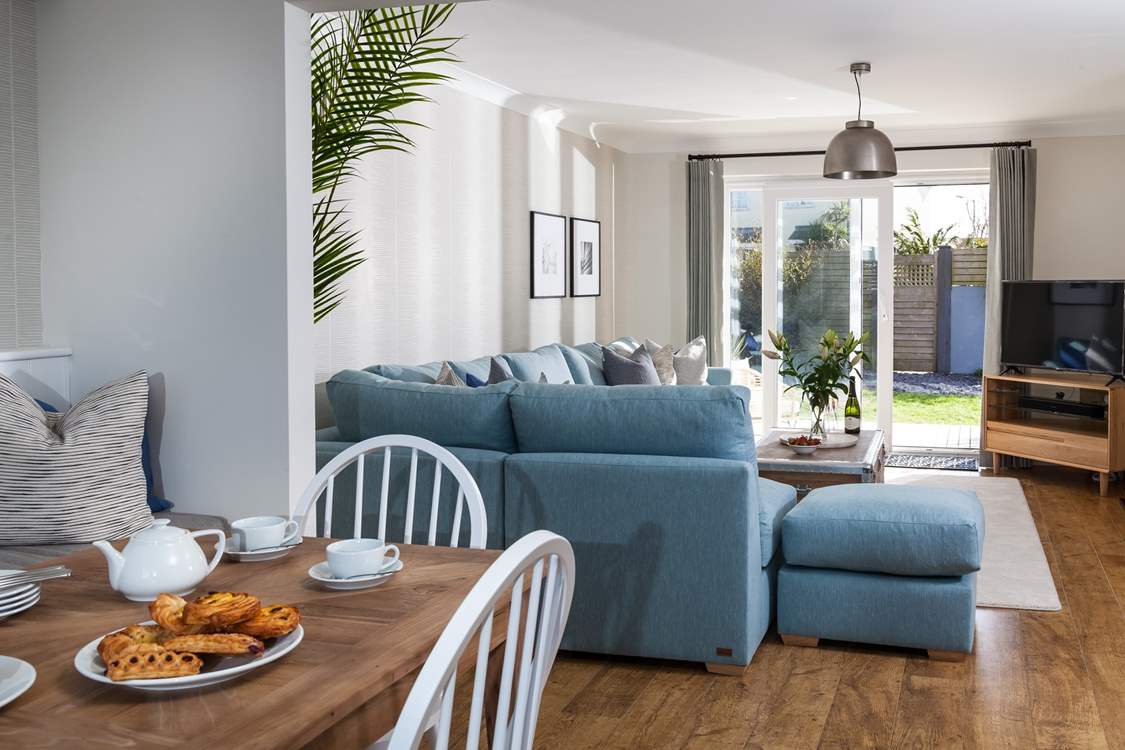 View from the dining-table into the sitting-area and out to the garden.