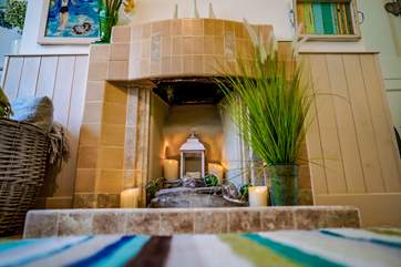 The ornamental fireplace offers a lovely focal point to the sitting-room.