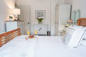 The master bedroom is seven steps up from the sitting-room and is situated to the back of the house and enjoys estuary views.