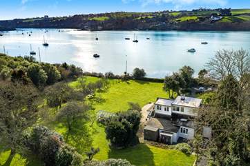 Calm Waters has water frontage and sits in the heart of this large private garden.