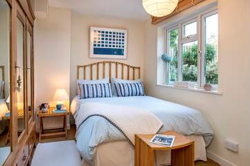 The bedroom overlooks the peaceful garden.