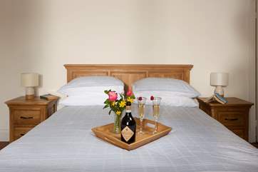 The master bedroom is tranquil and very peaceful, with beautiful original wooden floorboards. A wooden step leads up from the small landing into this room.