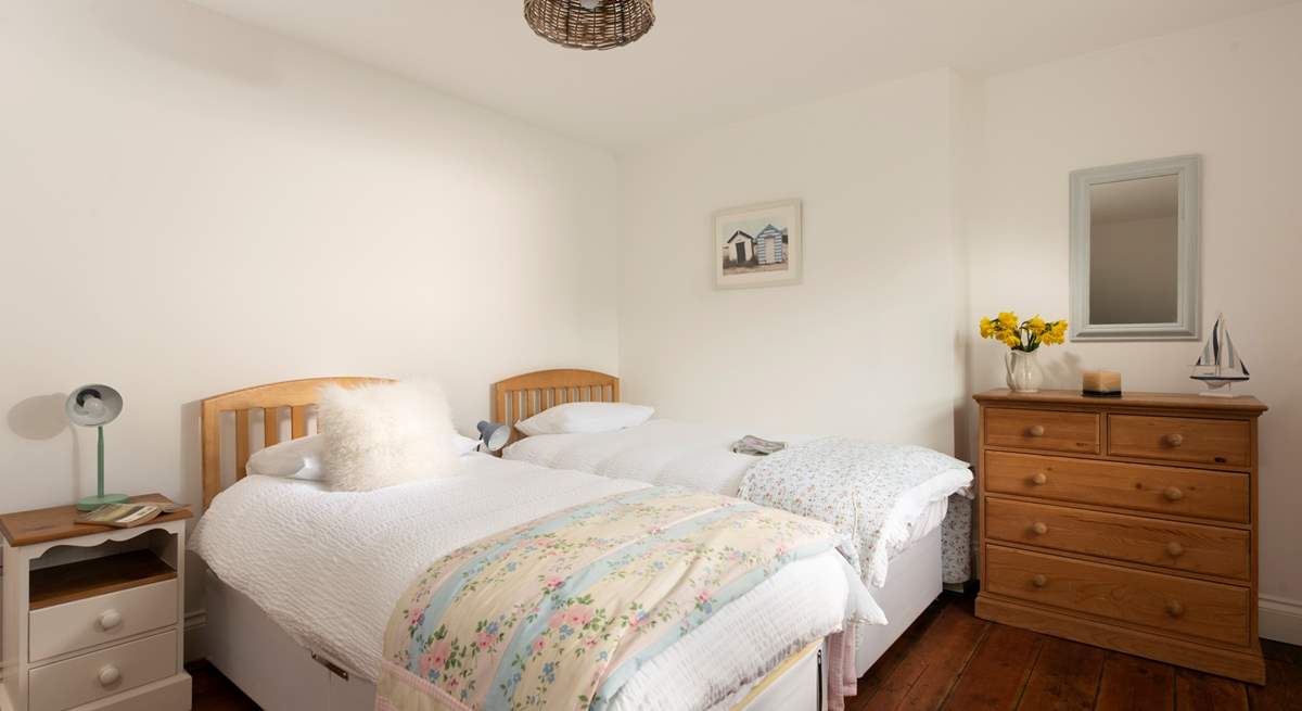 The twin bedroom has beautiful patchwork throws to add colour and also cosiness.