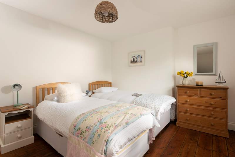 The twin bedroom has beautiful patchwork throws to add colour and also cosiness.