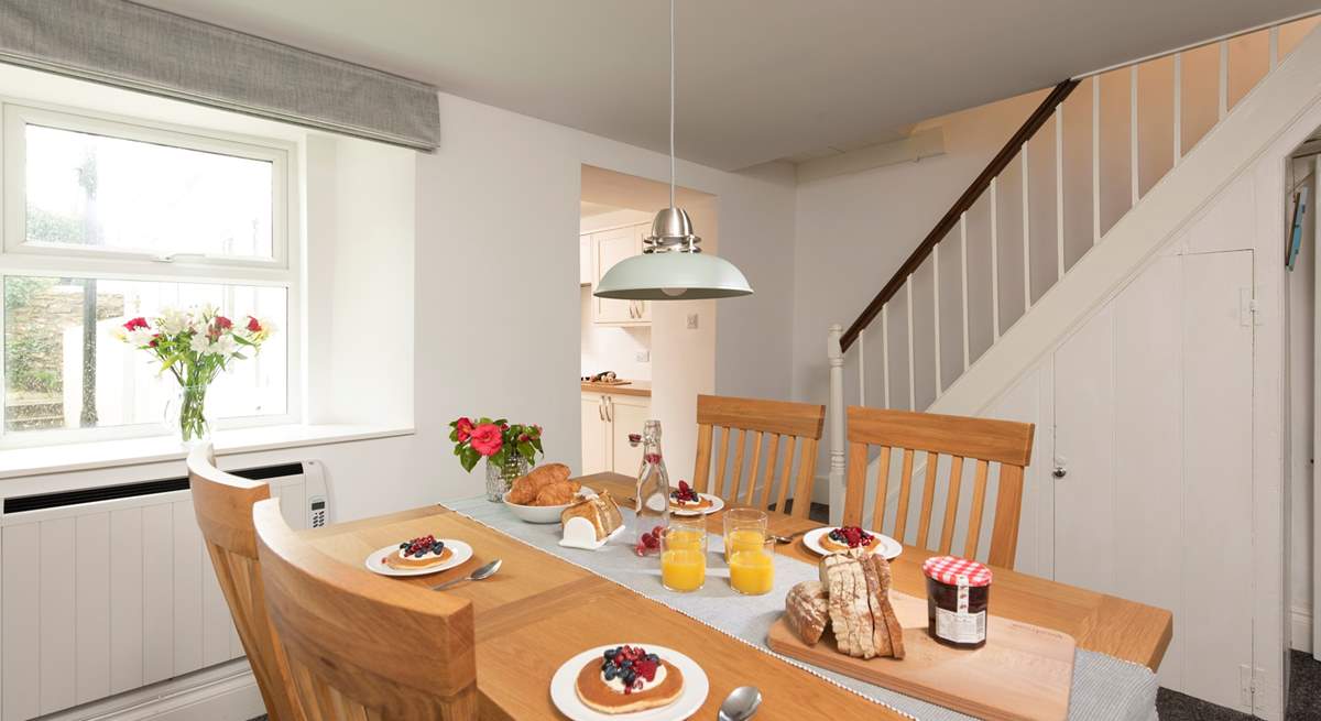 The dining-area is really quite spacious and leads out into the kitchen-area. In true Cornish character, this traditional cottage has a narrow staircase and a small landing, with a step leading into each bedroom.