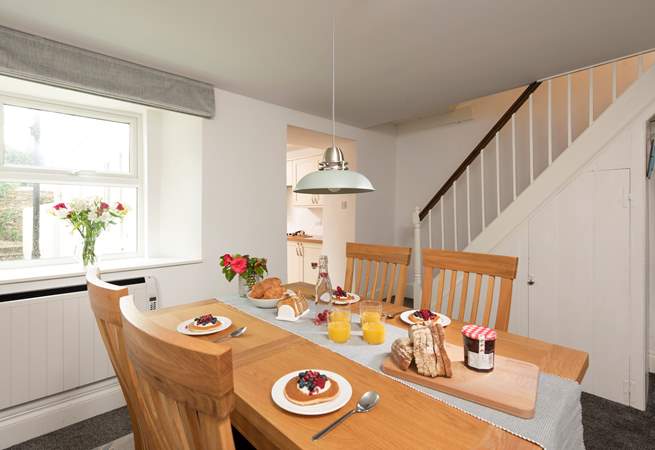 The dining-area is really quite spacious and leads out into the kitchen-area. In true Cornish character, this traditional cottage has a narrow staircase and a small landing, with a step leading into each bedroom.