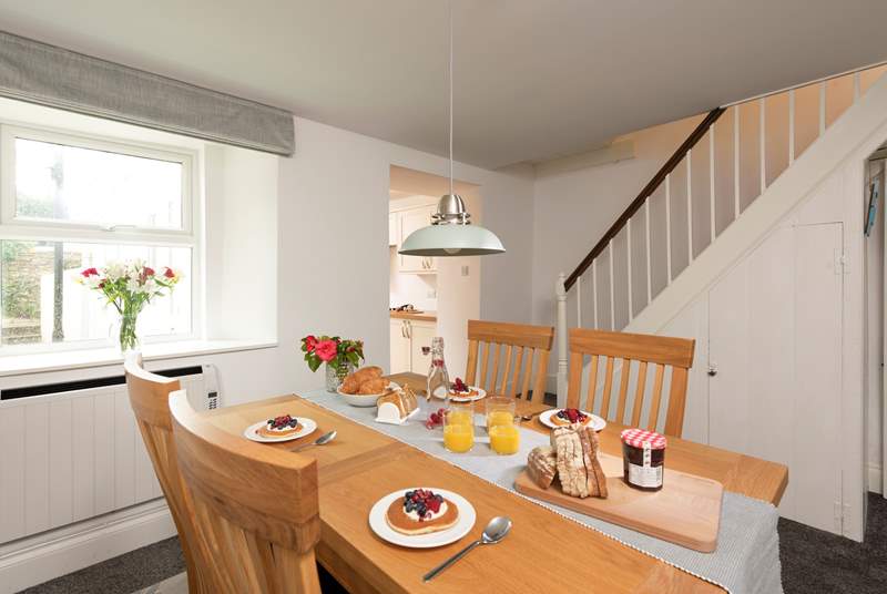 The dining-area is really quite spacious and leads out into the kitchen-area. In true Cornish character, this traditional cottage has a narrow staircase and a small landing, with a step leading into each bedroom.