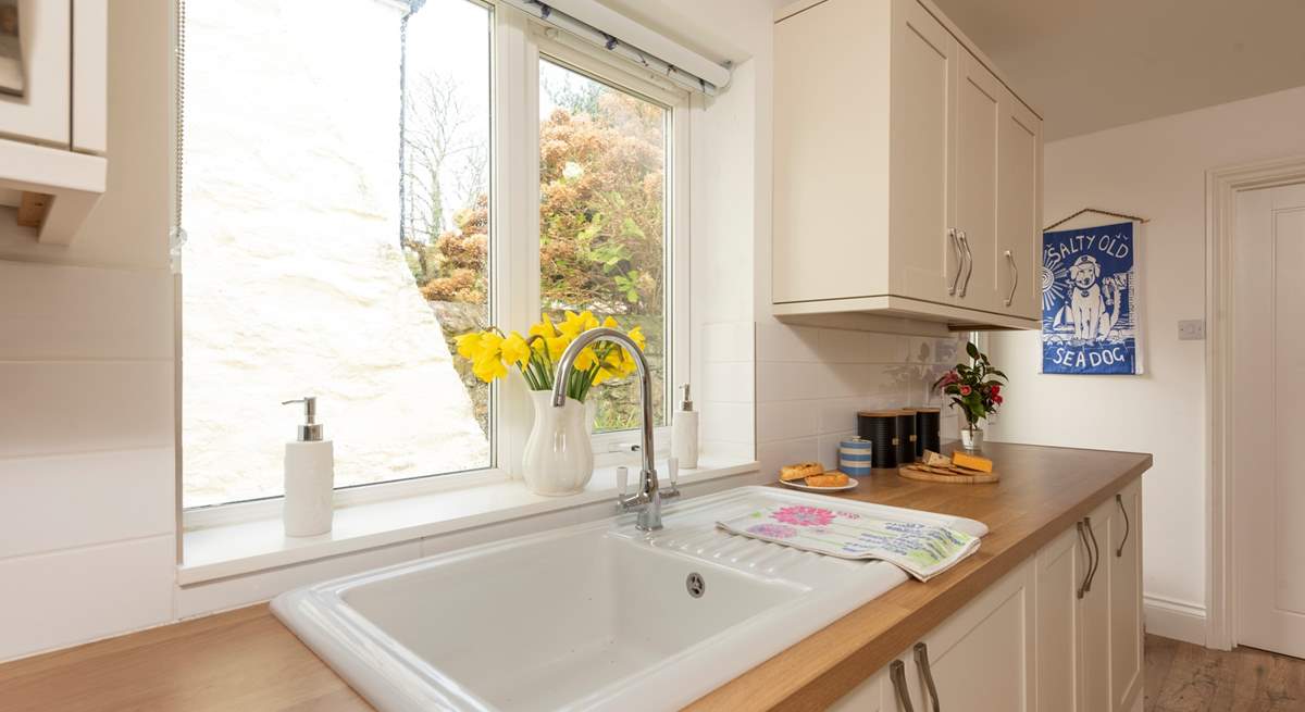 The kitchen window overlooks the rear courtyard. 