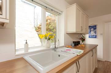 The kitchen window overlooks the rear courtyard.