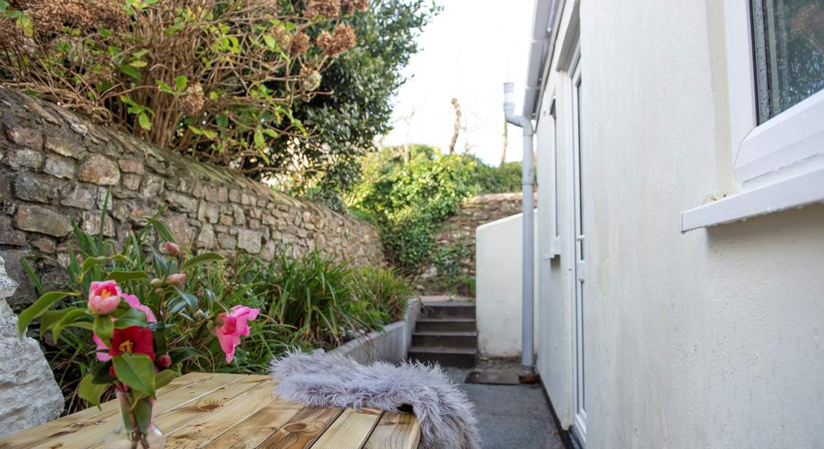 This is the rear courtyard. You can access this area from the kitchen or via the rear. Please note there are several steps leading down to this area. 