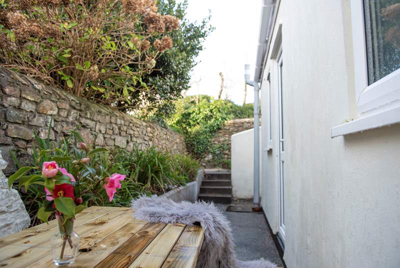 This is the rear courtyard. You can access this area from the kitchen or via the rear. Please note there are several steps leading down to this area. 