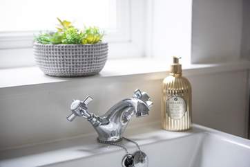 The cute little sink in the family bathroom.