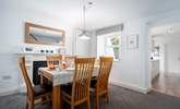 The dining-area is a lovely space to enjoy breakfast together. A small step takes you down into the kitchen area.  - Thumbnail Image