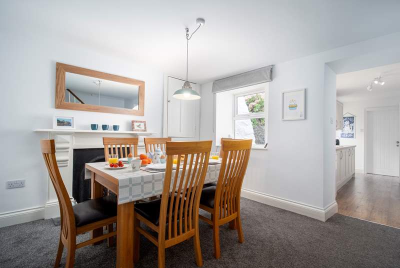 The dining-area is a lovely space to enjoy breakfast together. A small step takes you down into the kitchen area. 