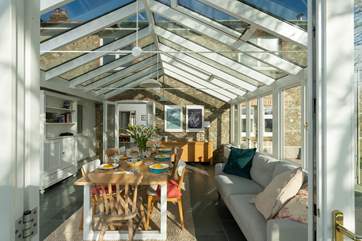 The garden-room has a cosy sofa too, making it a great additional living space.
